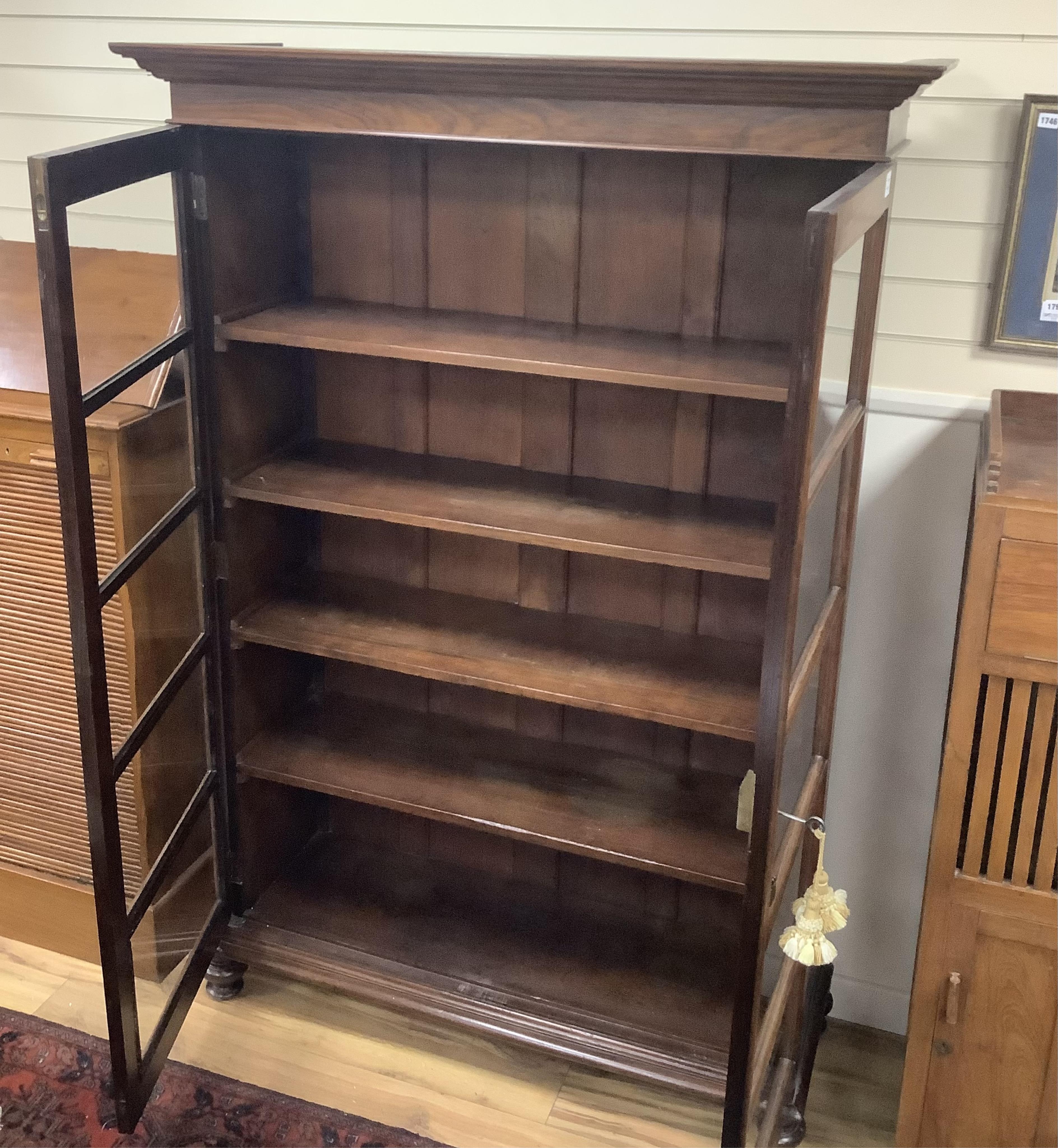 A 20th century Victorian style Anglo Indian rosewood bookcase, width 127cm, depth 44cm, height 186cm. Condition - good